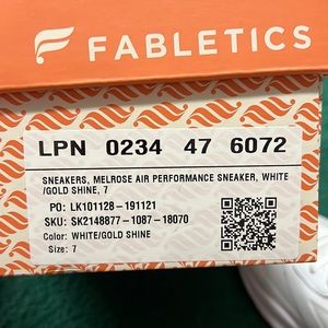 Fabletics white with gold fitness tennis shoes